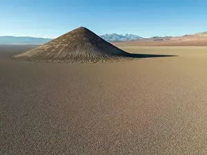 En Route Prints: Perfectly shaped Cono de Arita in the Salar de Arizaro in the morning - Exploring the Argentinian highlands called Puna