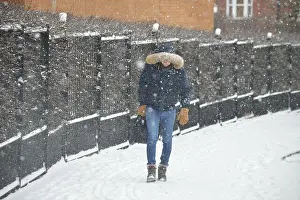 East London Prints: Person walking along a footpath in East London during heavy snow that was part of #BeastfromtheEast winter storm
