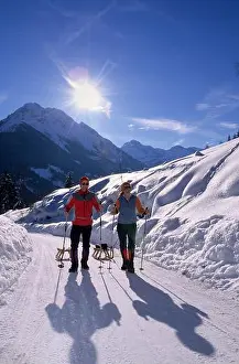 Salzburg Prints: Two persons with sledges, hiking to Kleinarler hut, valley of Kleinarl, Salzburg, Austria