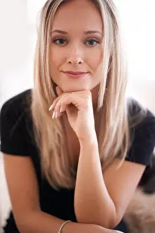 Blond Hair Prints: Nothing perturbs me. Portrait of a young woman sitting with her hand on her chin
