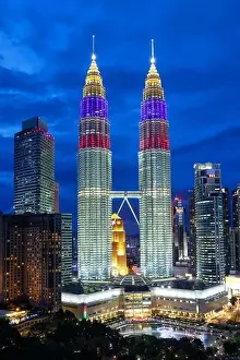 Petronas Twin Towers skyscrapers KLCC skyline at twilight landmark portrait format in Kuala Lumpur Malaysia