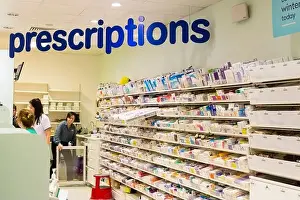 Customers Prints: Pharmacy prescriptions at Boots the chemist department store. Belfast, Northern Ireland