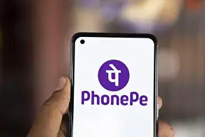 Cell Phone Prints: PhonePe logo is displayed on smartphone