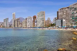 Summer Time Prints: Photo of the beautiful city of Benidorm in Spain in the summer time showing high rise apartments
