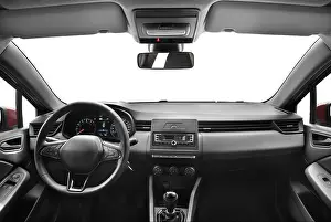 Steering Wheel Prints: A photo captured from the middle of the back seat of a modern passenger car