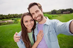 Photographing Prints: Photo of cheerful smiling beautiful married couple take selfie wife husband enjoying summer vacation celebrate