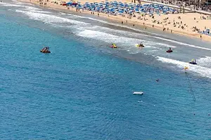 Photo of the city of Benidorm in Spain in the summer time showing people on the famous Levante Beach