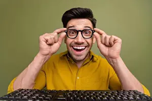 Developer Prints: Photo of excited cheerful positive man wear yellow stylish clothes hold eyeglasses looking camera isolated on khaki