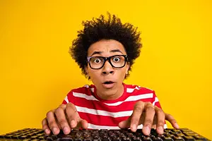Gamer Prints: Photo of excited impressed guy wear striped t-shirt chatting instagram twitter telegram facebook isolated yellow color