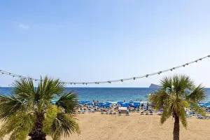 Summer Time Prints: Photo of the famous Levante Beach in Benidorm Spain showing people having fun on the Spanish beach on a hot sunny day