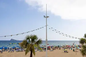 Summer Time Prints: Photo of the famous Levante Beach in Benidorm Spain showing people having fun on the Spanish beach on a hot sunny day
