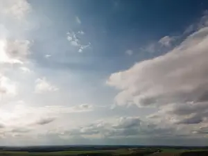 Morning Sky Prints: Photo from a flying drone, blue sky and white clouds. Texture background for design