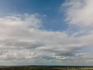 Morning Sky Prints: Photo from a flying drone, blue sky and white clouds. Texture background for design