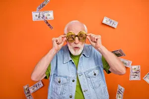 Dollars Prints: Photo of funky excited man pensioner dressed retro denim vest dollars eyewear winning jackpot isolated orange color