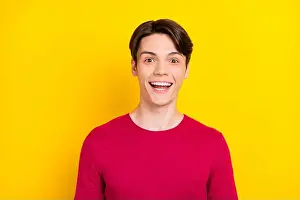 Surprised Prints: Photo of impressed brunet millennial guy wear red sweater isolated on yellow background