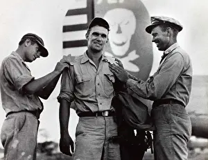 Jolly Prints: This photo showcases Major Briggs and other key personnel from the 90th Bomb Group