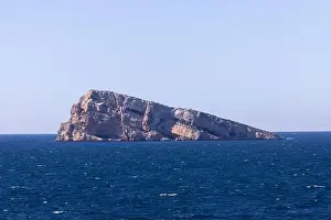 Vacation Destinations Prints: Photo of the town of Benidorm in Spain showing the rock in the middle of the ocean known as Isla de Benidorm or Mirador