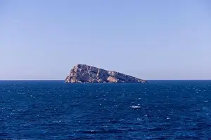 Vacation Destinations Prints: Photo of the town of Benidorm in Spain showing the rock in the middle of the ocean known as Isla de Benidorm or Mirador