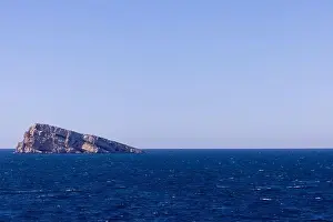 Vacation Destinations Prints: Photo of the town of Benidorm in Spain showing the rock in the middle of the ocean known as Isla de Benidorm or Mirador