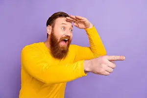 Surprised Prints: Photo of young businessman screaming direct finger empty space hand forehead funny stand up show isolated on purple