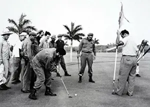 Che Guevara Prints: Photograph of Che Guevara (1928-1967) and Fidel Castro (1926-) playing golf to mock President Dwight D