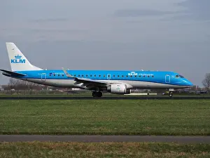 Professionals Prints: A photograph of a KLM Cityhopper Embraer ERJ-190STD (ERJ-190-100) aircraft at Schiphol Airport (AMS)
