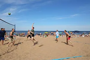 Muscular Prints: Photograph of people playing beach volleyball in summer