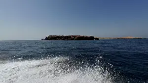 Water Edge Prints: Photography of small islands sanctuary in Oman near Muscat shot from a boat during spring sunny day