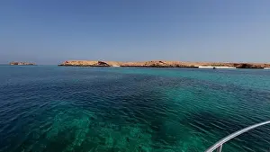 Water Edge Prints: Photography of small islands sanctuary in Oman near Muscat shot from a boat during spring sunny day
