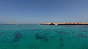 Water Edge Prints: Photography of small islands sanctuary in Oman near Muscat shot from a boat during spring sunny day