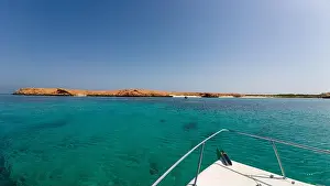 Water Edge Prints: Photography of small islands sanctuary in Oman near Muscat shot from a boat during spring sunny day