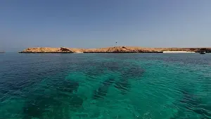 Water Edge Prints: Photography of small islands sanctuary in Oman near Muscat shot from a boat during spring sunny day