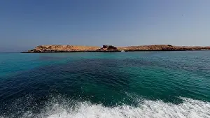 Water Edge Prints: Photography of small islands sanctuary in Oman near Muscat shot from a boat during spring sunny day