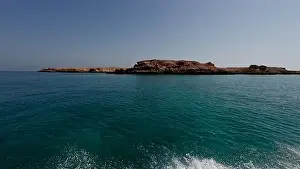Water Edge Prints: Photography of small islands sanctuary in Oman near Muscat shot from a boat during spring sunny day