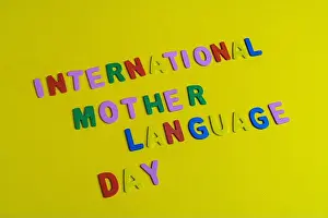 Promote Prints: the phrase international mother language day written formed with colorful letters