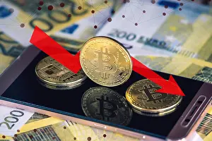 Transaction Prints: Physical bitcoin coin on the phone screen on the background of the Euro banknotes