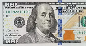 Paying Prints: A picture of a part of a 100 bill