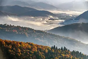 Picturesque autumn landscape with fooggy village in the Carpathian mountains, Ukraine. Landscape photography