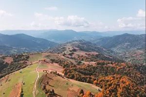 Picturesque autumn mountains with red beech forest in the Carpathian mountains, Ukraine. Landscape photography