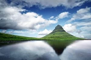 Images Dated 20th June 2016: Picturesque landscape with Kirkjufell mountain, clear lake and cloudscape in blue sky