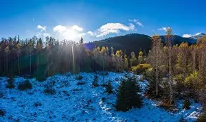 Picturesque mountain landscapes of autumn with snow near the village of Dzembronya in Ukraine Carpathians mountains