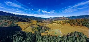 Picturesque mountain landscapes of autumn with snow near the village of Dzembronya in Ukraine Carpathians mountains