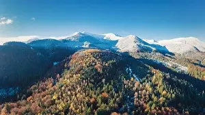 Smotrich Prints: Picturesque mountain landscapes of autumn with snow near the village of Dzembronya in Ukraine Carpathians mountains