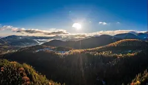Picturesque mountain landscapes of autumn with snow near the village of Dzembronya in Ukraine Carpathians mountains