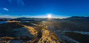 Picturesque mountain landscapes of autumn with snow near the village of Dzembronya in Ukraine Carpathians mountains