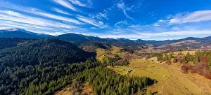 Picturesque mountain landscapes of autumn with snow near the village of Dzembronya in Ukraine Carpathians mountains