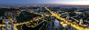 picturesque panoramic aerial view cityscape with bright street illumination. drone photo