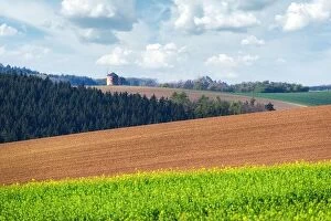 Images Dated 20th April 2019: Picturesque rural landscape with old windmill and green and brown sunny spring hills