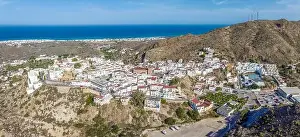 Picturesque spanish hillside white washed village of Mojacar during sunny day against blue sky
