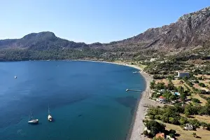 Mountain Resort Prints: Picturesque view from cape Asarjik to Kumlubuk bay in Mediterranean sea with yachts and beach hotels